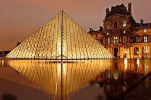 Louvre Museum at sundown, perfectly lit.