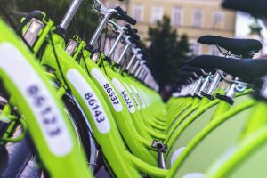 Rental bikes parked in the parkway.